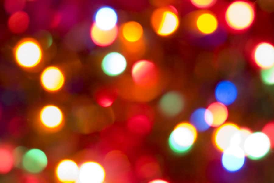 A blurred background of colorful bokeh lights.