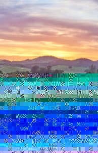 A colorful sunset over rolling hills with a glitch effect. A colorful sunset over rolling hills with a glitch effect.