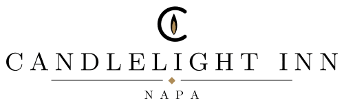 A stylized logo featuring a candle silhouette with a flame above it.